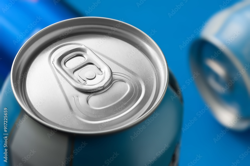 Aluminum beer can on blue background close-up Aluminum beer can on blue background close-up