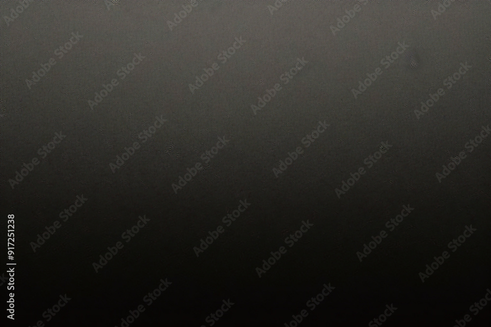 Black foil gradient texture background with uneven surface Black foil gradient texture background with uneven surface