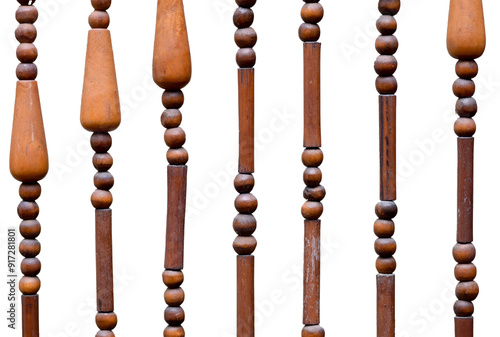 a close-up of a wooden beaded curtain hanging against a white background. photo