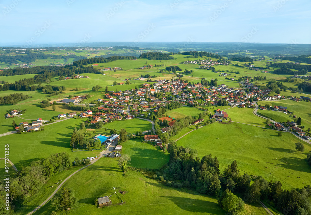 Fototapeta premium aerial view of the village of Oberreute with surround landscape in the Allgaeu Alps, Bavaria, Germany
