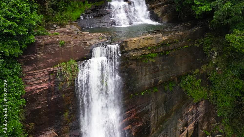 Waterfall in a tropical forest. Aerial drone of Thaliya Wetuna Falls. Sri Lanka. Waterfall in a tropical forest. Aerial drone of Thaliya Wetuna Falls. Sri Lanka.