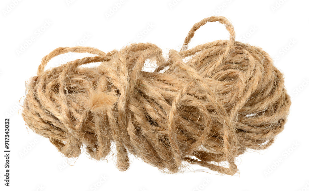 Brown twine rope on a white isolated background, top view. Packing natural Brown twine rope on a white isolated background, top view. Packing natural