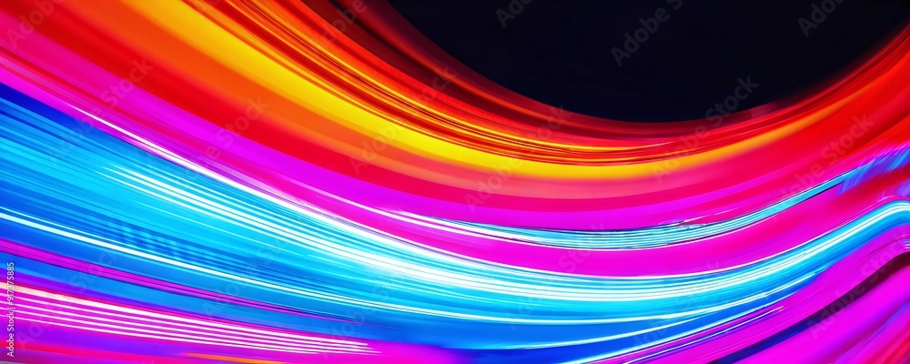 Fototapeta premium Vibrant neon light trails create dynamic patterns in dark urban environment