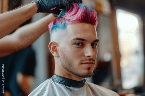 Young Man with Pink and Blue Hair Getting Styled at Barber Shop, Close-Up Portrait photo