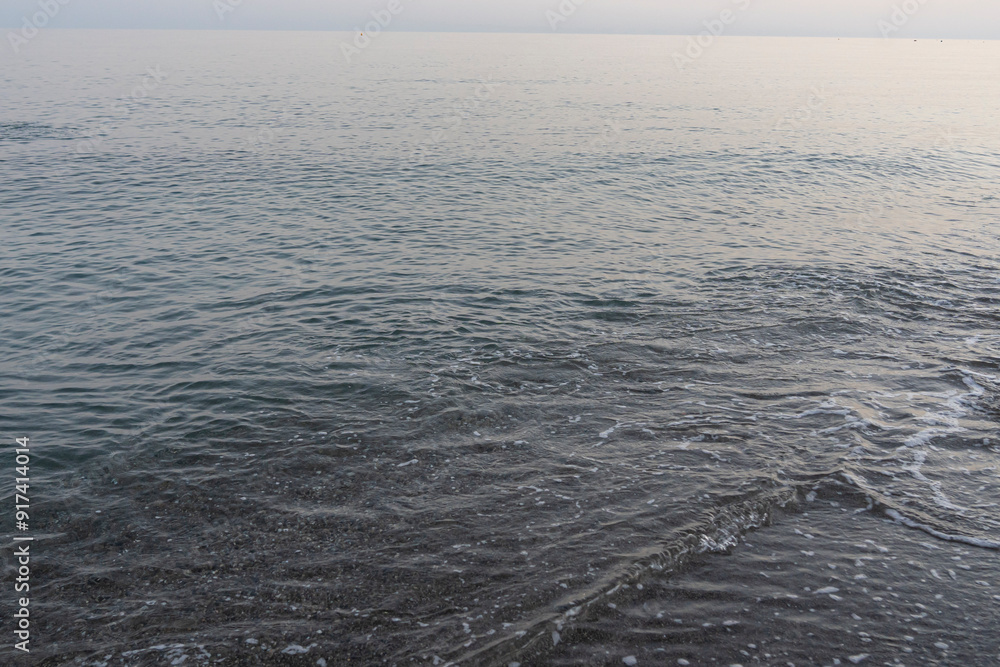 Serene Evening Waves on a Quiet Beach in Málaga, Spain Serene Evening Waves on a Quiet Beach in Málaga, Spain