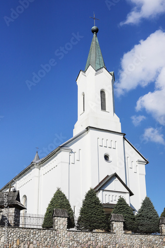 PIEKIELNIK, POLAND - AUGUST 06, 2024: Beautiful white church in Piekielnik, Poland. photo