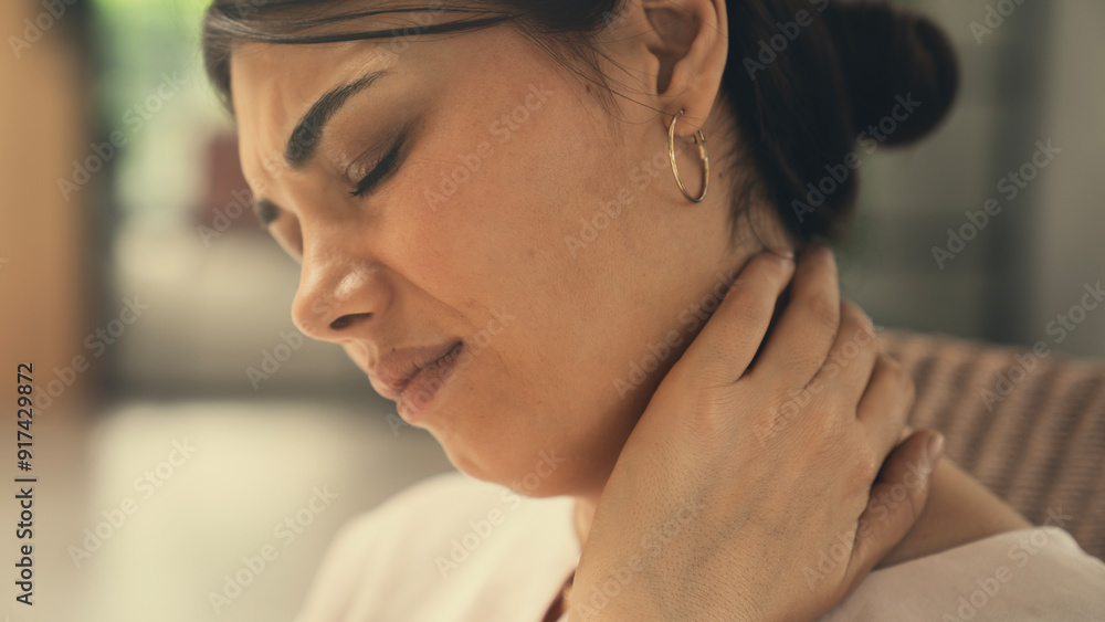 Woman suffering from neck ache Woman suffering from neck ache