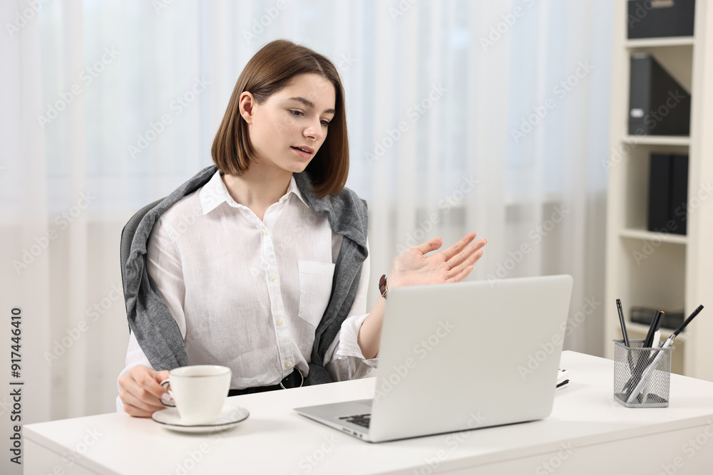 Teenager having video chat via laptop at home. Remote work Teenager having video chat via laptop at home. Remote work