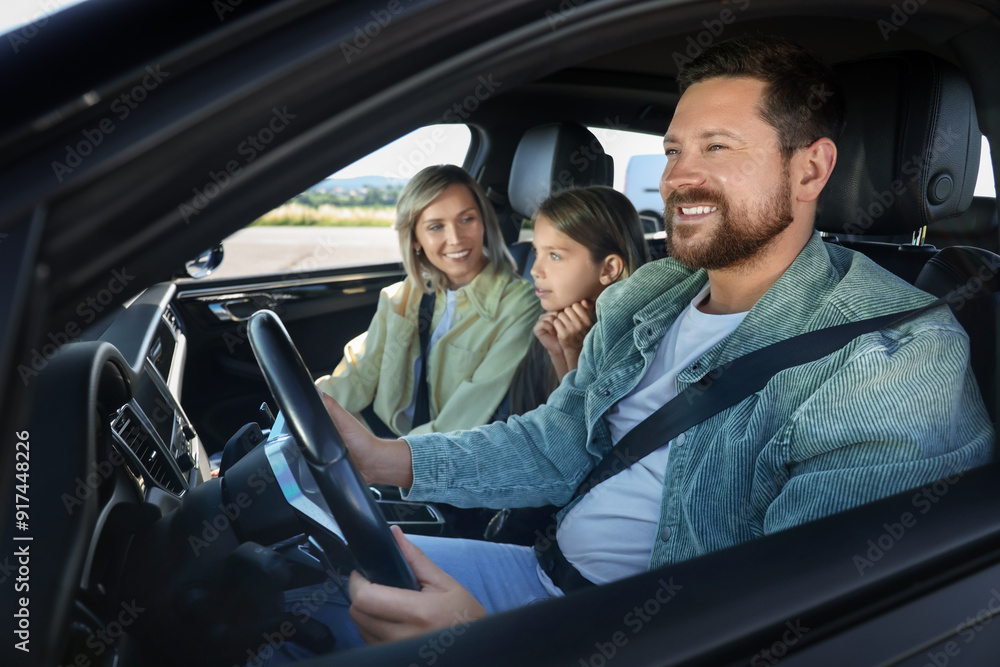 Happy family enjoying trip together by car, view from outside Happy family enjoying trip together by car, view from outside