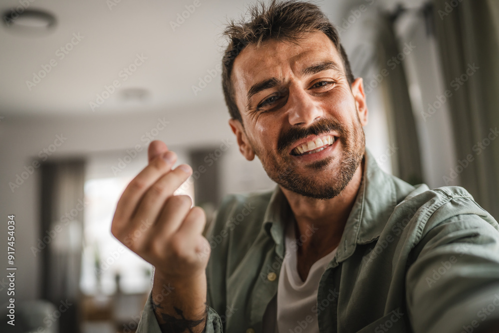 self portrait of adult excited man stand and smile at home self portrait of adult excited man stand and smile at home