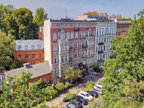 Beautiful renovated pre-WWII residential buildings in a quiet street in Kreuzberg district in Berlin, Germany photo