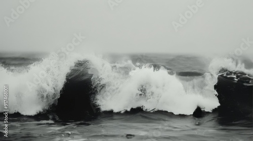 Powerful Waves Crash Against Rocky Shoreline During Stormy Weather