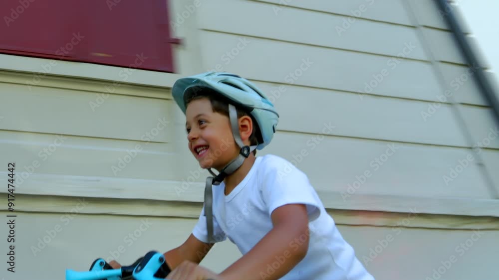 Young boy riding his bicycle in the bright sunlight, wearing a helmet and smiling, enjoying a fun outdoor activity on a sunny day, showcasing the joy and freedom of childhood Young boy riding his bicycle in the bright sunlight, wearing a helmet and smiling, enjoying a fun outdoor activity on a sunny day, showcasing the joy and freedom of childhood