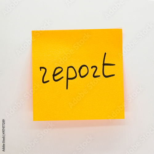 handwritten Report word on sticky note