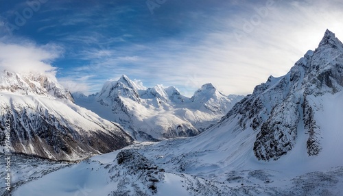 Wallpaper Mural A group of imposing mountains covered in a blanket of thick snow, creating a stunning winter landscape in a remote, icy terrain. Torontodigital.ca