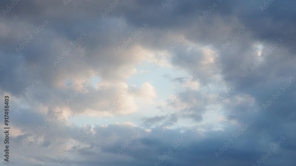 Clouds are floating across the sky, solar intervals. The weather is getting worse. Delicate blue, yellow and pink colors of the sunset. Real time. Slow cloud movements. High quality 4k footage. Clouds are floating across the sky, solar intervals. The weather is getting worse. Delicate blue, yellow and pink colors of the sunset. Real time. Slow cloud movements. High quality 4k footage.