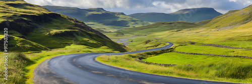 Empty road winding through serene countryside landscape photo