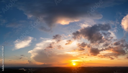 panorama of dramatic sunset sky with setting sun