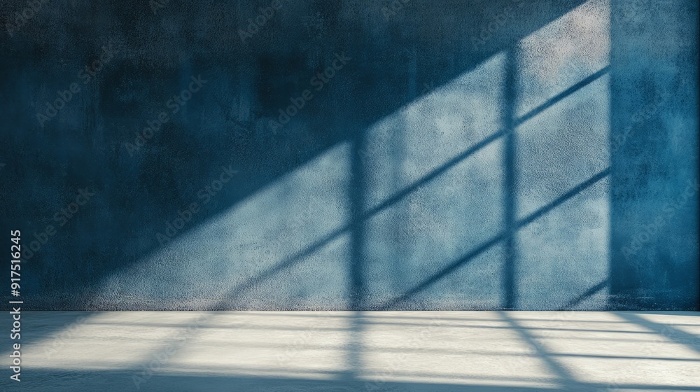 Blue cement wall in empty room with light and shadow. stock photo Blue cement wall in empty room with light and shadow. stock photo