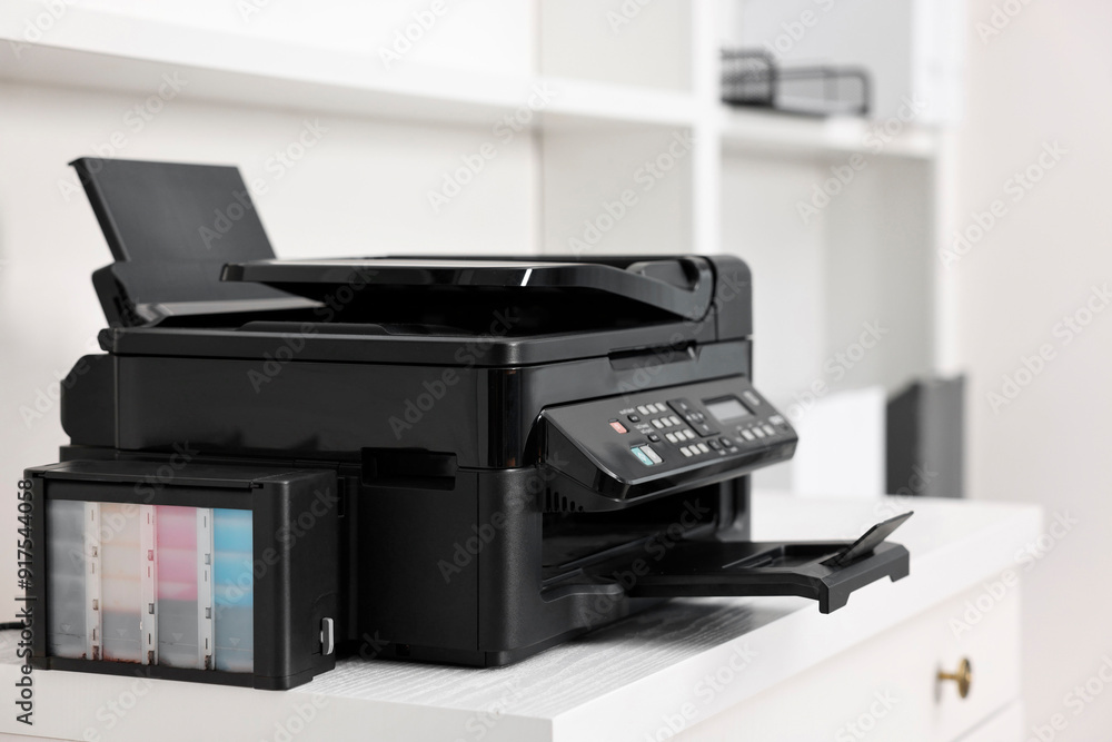 Modern printer on white table in office Modern printer on white table in office