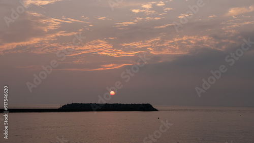 黄金色に染まる海と港 photo