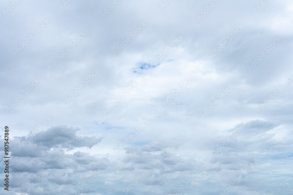 Bright blue sky with fluffy white clouds on a sunny day Bright blue sky with fluffy white clouds on a sunny day