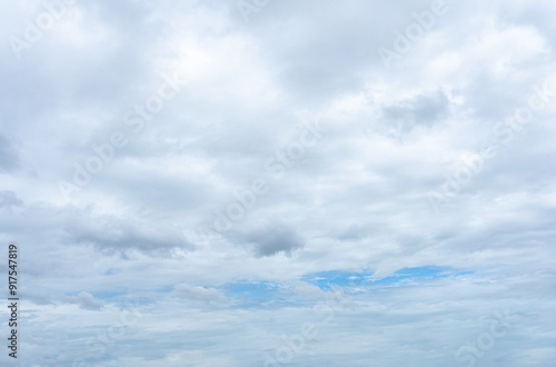 Bright blue sky with fluffy white clouds on a sunny day photo