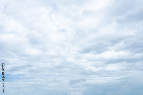 Bright blue sky with fluffy white clouds on a sunny summer day photo