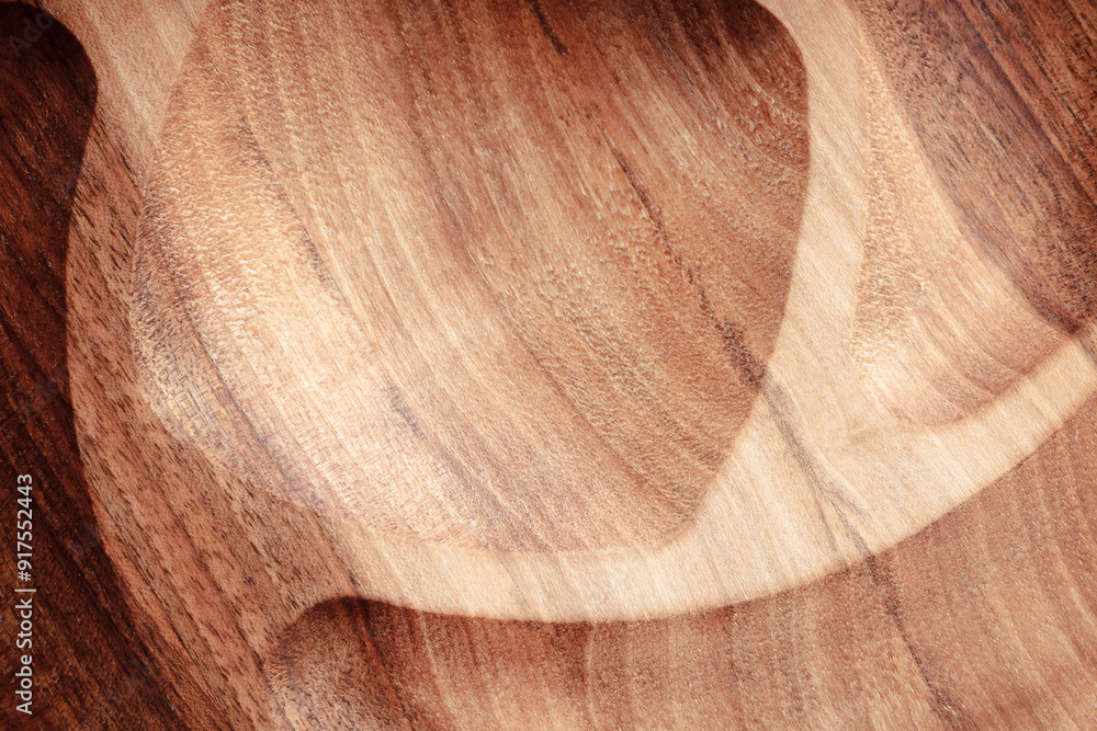 Naklejka premium The sideboard is made of wood for serving snacks, fruits, nuts, cheeses, meats and original serving of main dishes. Luxury products from hard and exotic wood species. Accessories for a modern kitchen.