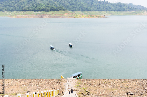 Tourist boats take tourists on tours of the dam. Tourists walk down the stairs to the pier. Khun Dan Prakarn Chon huge concrete dam in Thailand photo