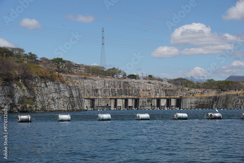 Hydraulic dam, boat, sky, sumidero canyon, clouds, grijalva river, trees, vegetation, mountains at chiapas, mexico photo