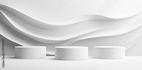 Minimalist display stands with wavy backdrop in a modern exhibition hall.