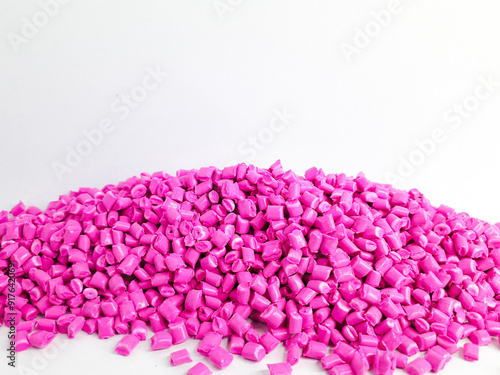Billede på lærred Neon pink masterbatch granules on white background