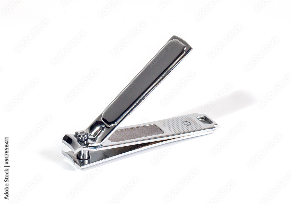 Silver nail clippers isolated on white background. Tools for manicure and pedicure care. Silver nail clippers isolated on white background. Tools for manicure and pedicure care.