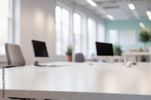 Wallpaper Mural Minimalist office interior with empty desk featuring a sleek computer setup, including a monitor, keyboard, and mouse, against a backdrop of modern furniture and technology Torontodigital.ca