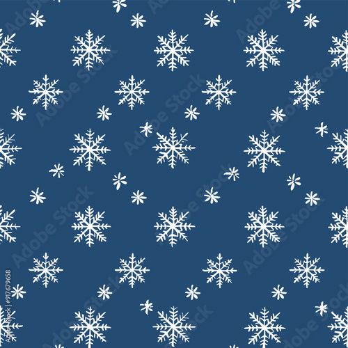Seamless pattern of white snowflakes on a blue background perfect for wintery designs festive decorations and holiday celebrations