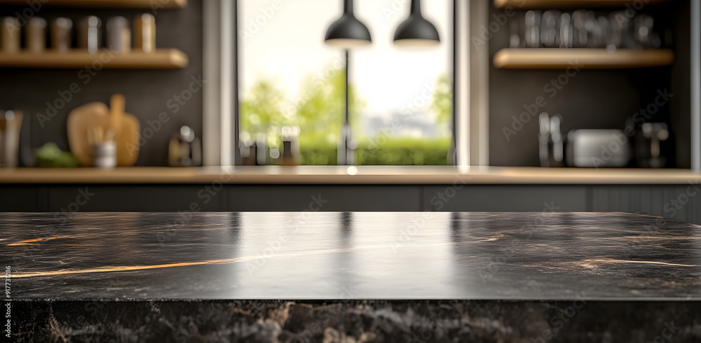 Modern empty dark marble table top or kitchen island on blurry bokeh kitchen room interior background. for montage product display. Modern empty dark marble table top or kitchen island on blurry bokeh kitchen room interior background. for montage product display.