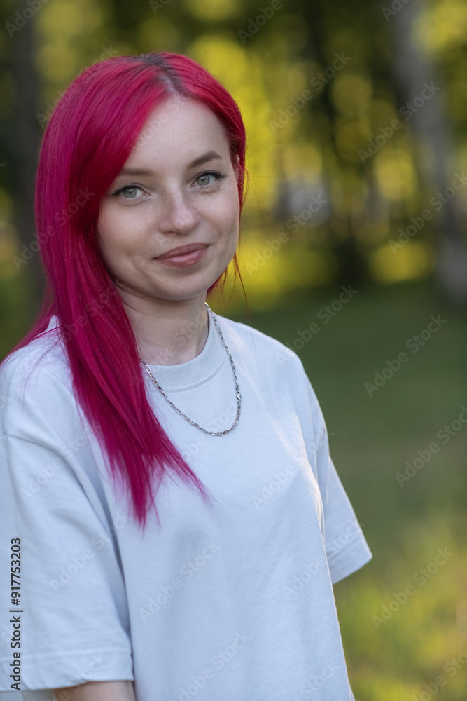 Portrait of a young red-haired girl in the park. Portrait of a young red-haired girl in the park.