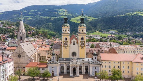 aerial drone view, Brixen, Bressanone city. View on the grand place with the cathedral and St. Michael church. sunny summer view. Photo for tourist brochure, publicity. City in south Tyrol.