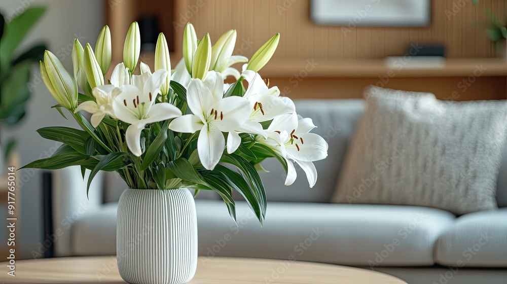 A bouquet of fresh lilies arranged in a sleek, modern vase, adding elegance and beauty to any contemporary space. A bouquet of fresh lilies arranged in a sleek, modern vase, adding elegance and beauty to any contemporary space.