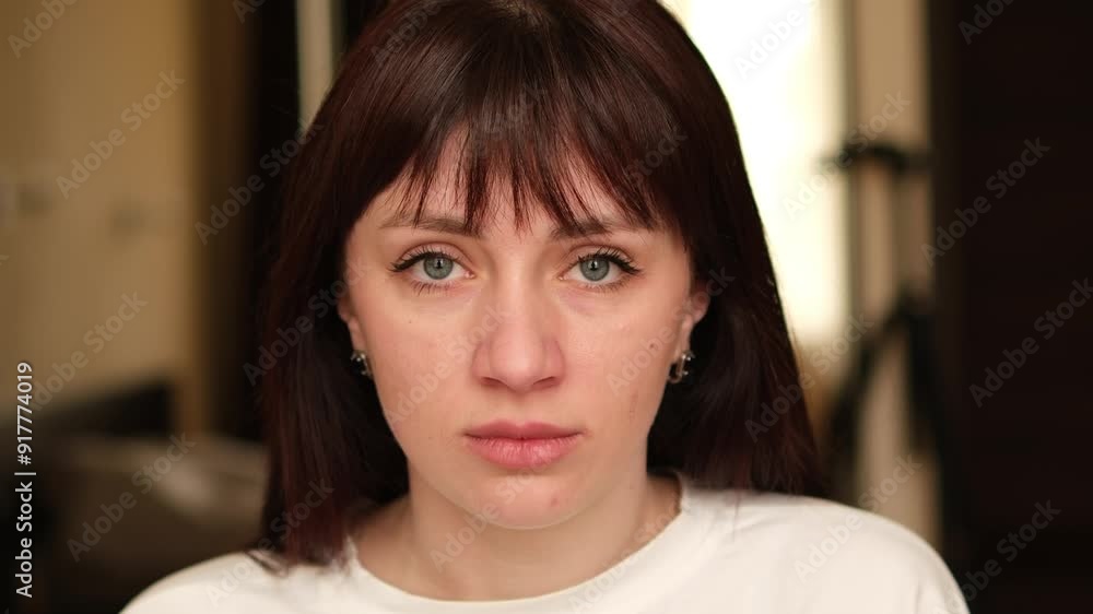The gaze of a young beautiful brunette. Zooming in on the camera The gaze of a young beautiful brunette. Zooming in on the camera
