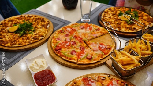 Pizza and Fries on Table