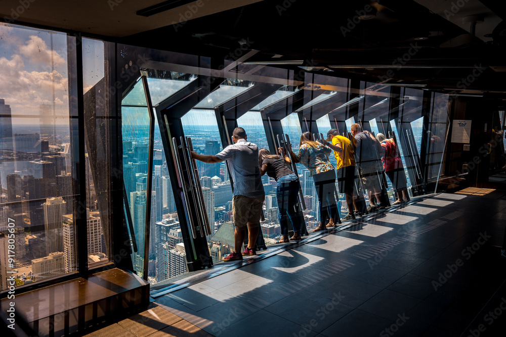 Obraz premium Chicago, Illinois, USA - Aug 15, 2019: Tilting glass at John Hancock Center observation area