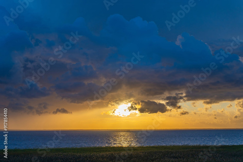 Evening Sky with Dramatic Clouds Over the Lake. Dramatic Sunset Over the Lake. The Sabbath. National Sunset Day. Vortsjarve Lake Estonia photo