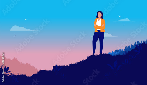 Woman enjoying fresh air outside - Person standing alone in nature wilderness smiling while taking a break from it all