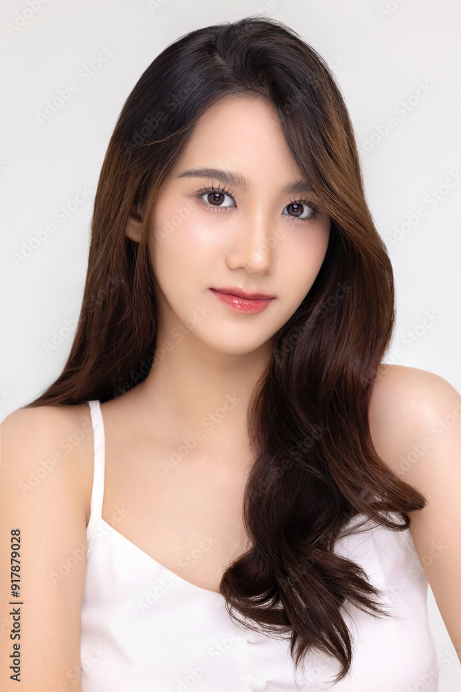 Beautiful young Asian woman with natural beauty make up style shows healthy and perfect skin on isolated background. Facial and skin care concept for commercial advertising. Beautiful young Asian woman with natural beauty make up style shows healthy and perfect skin on isolated background. Facial and skin care concept for commercial advertising.