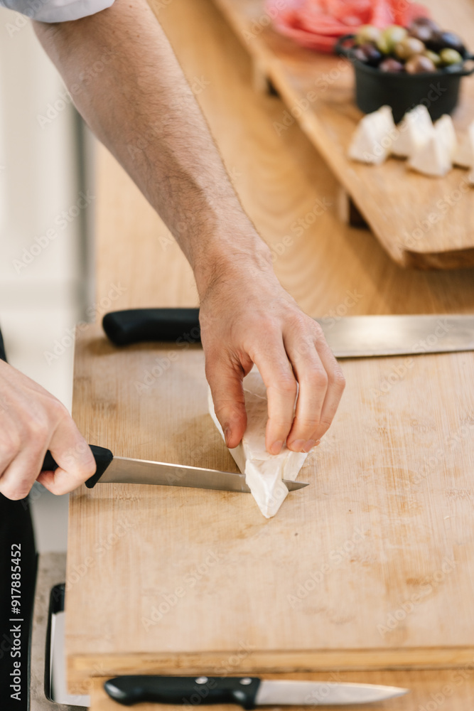Private chef preparing food on cutting board Private chef preparing food on cutting board
