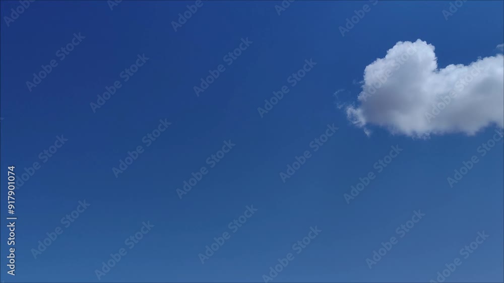 White cumulus retreats as it changes shape White cumulus retreats as it changes shape