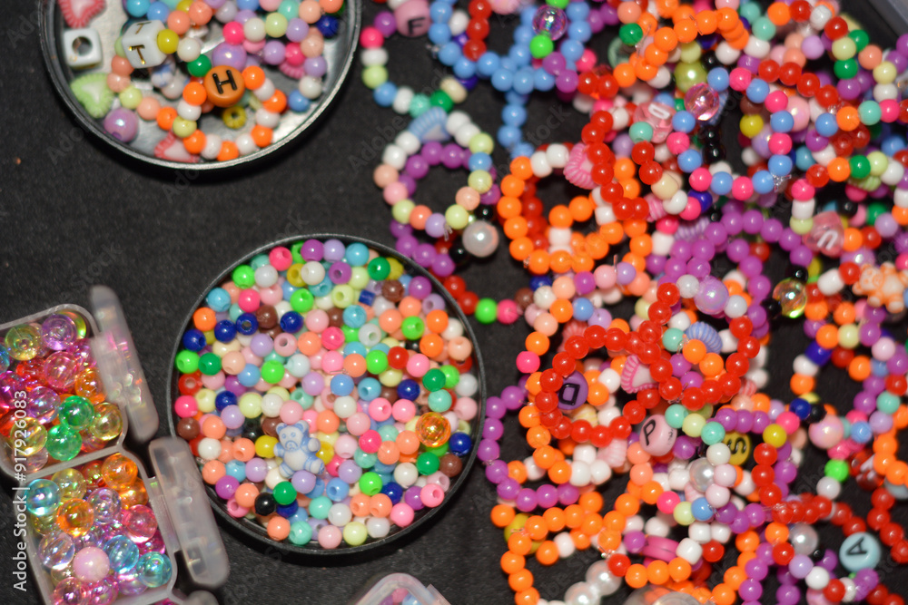 Beading workplace with hands in the process of handicraft. Beautiful diy jewelry and calming stress releasing hobby and activity Beading workplace with hands in the process of handicraft. Beautiful diy jewelry and calming stress releasing hobby and activity
