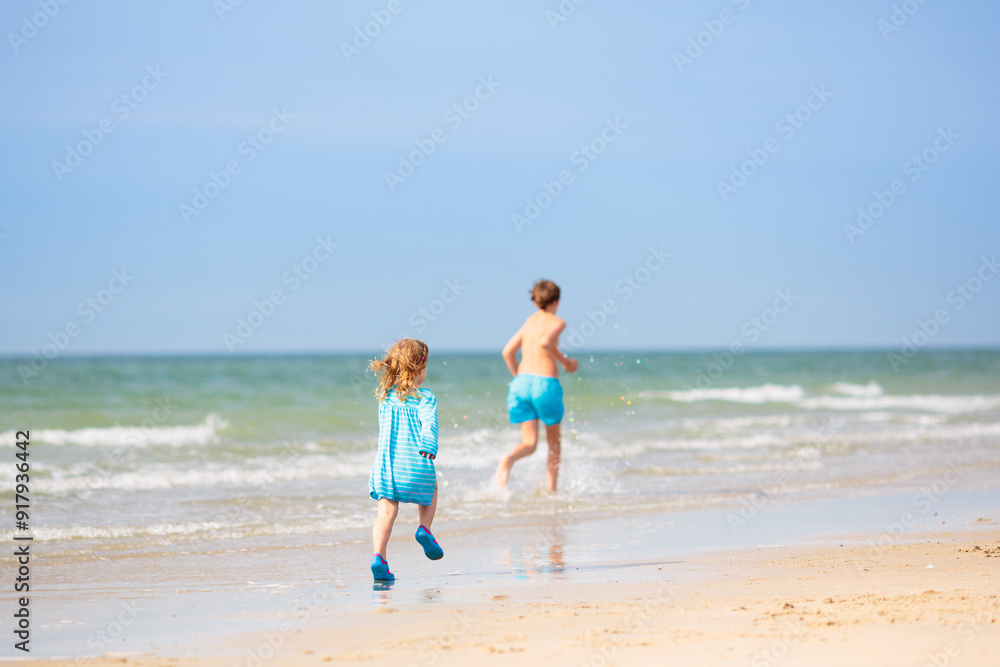 Kids playing on beach. Children play at sea. Kids playing on beach. Children play at sea.